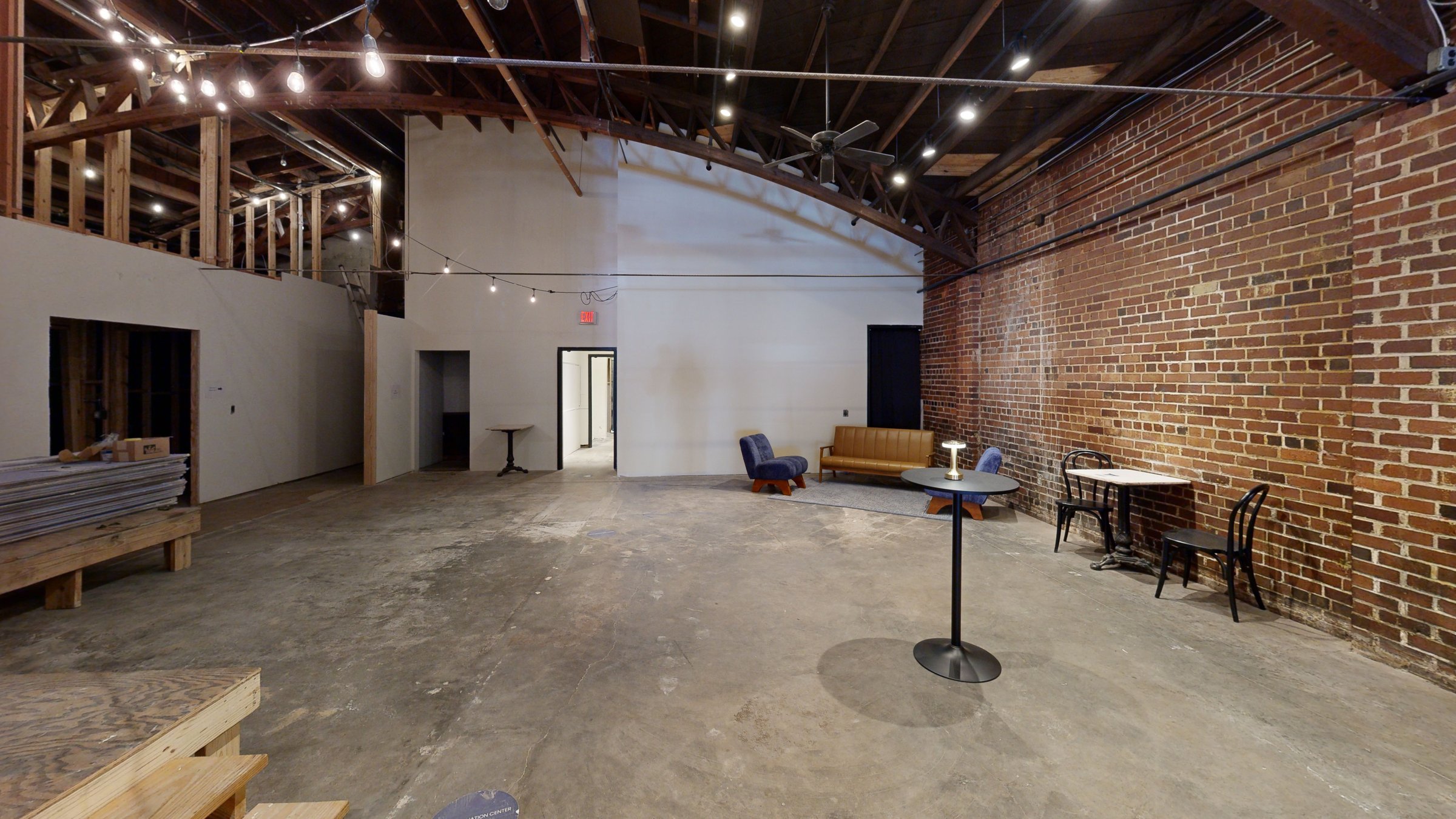 Open workspace with exposed brick at Boyd Innovation Center