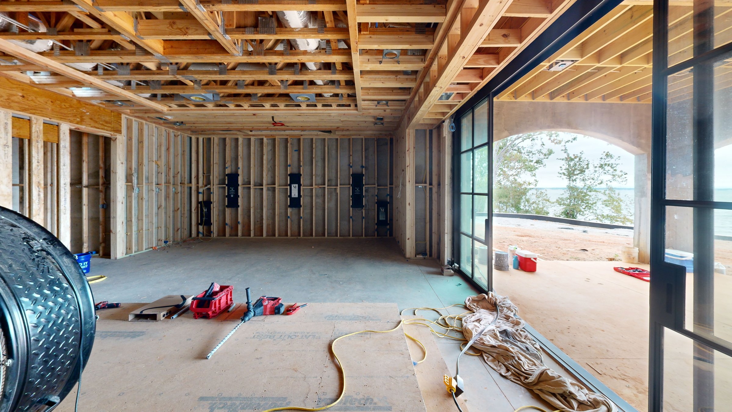 Framed room with windows before insulation and drywall