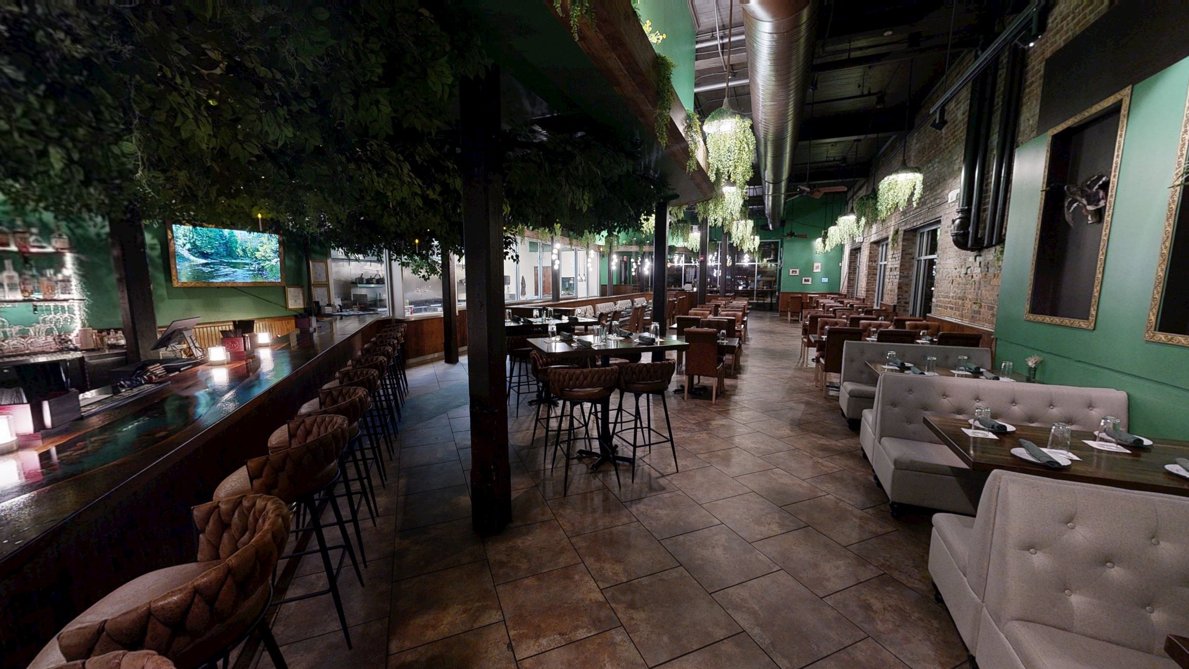 The Hollow dining room under the tree canopy