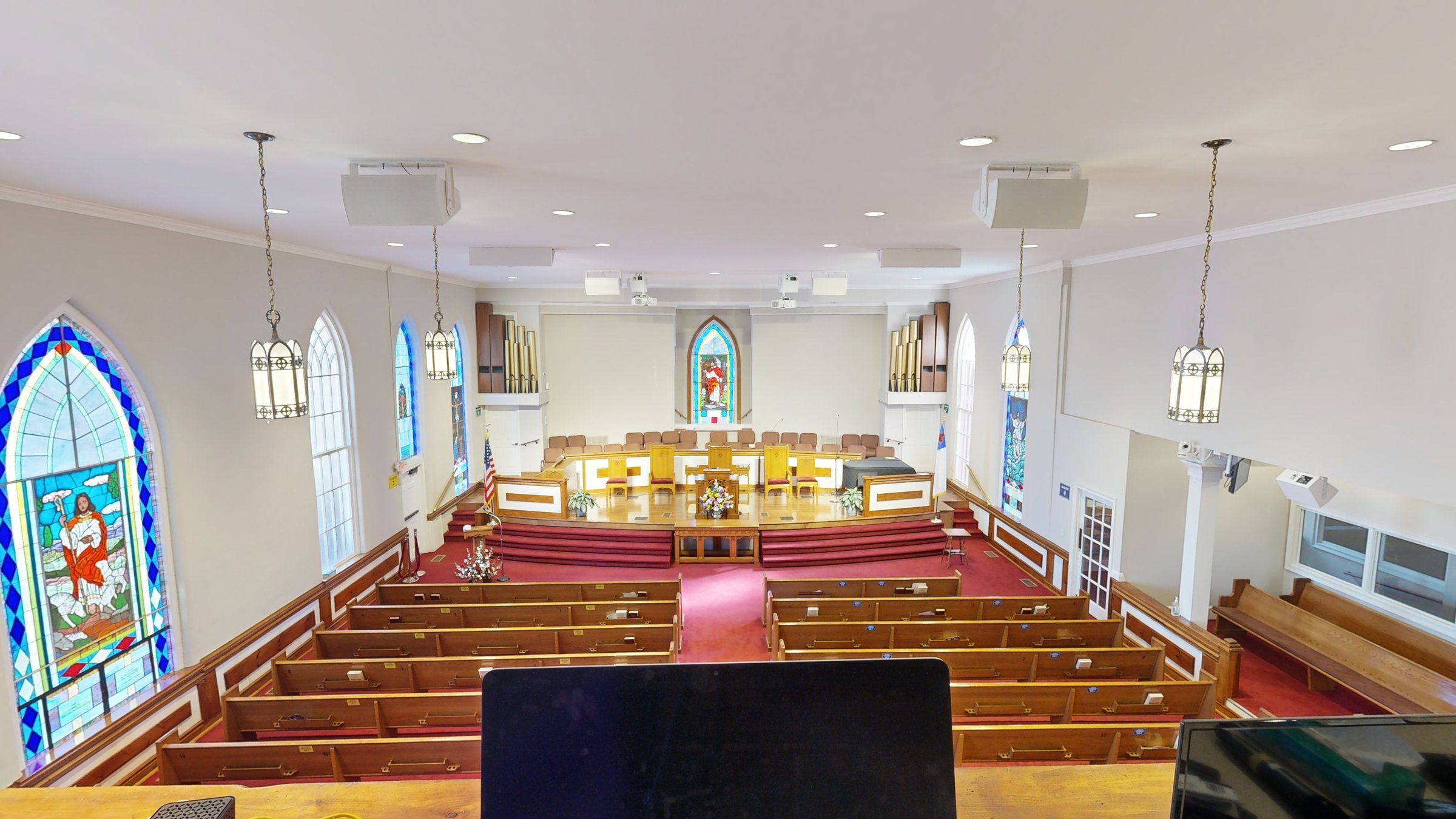 Stained glass and sanctuary seating at Trinity Baptist Church, Florence, SC